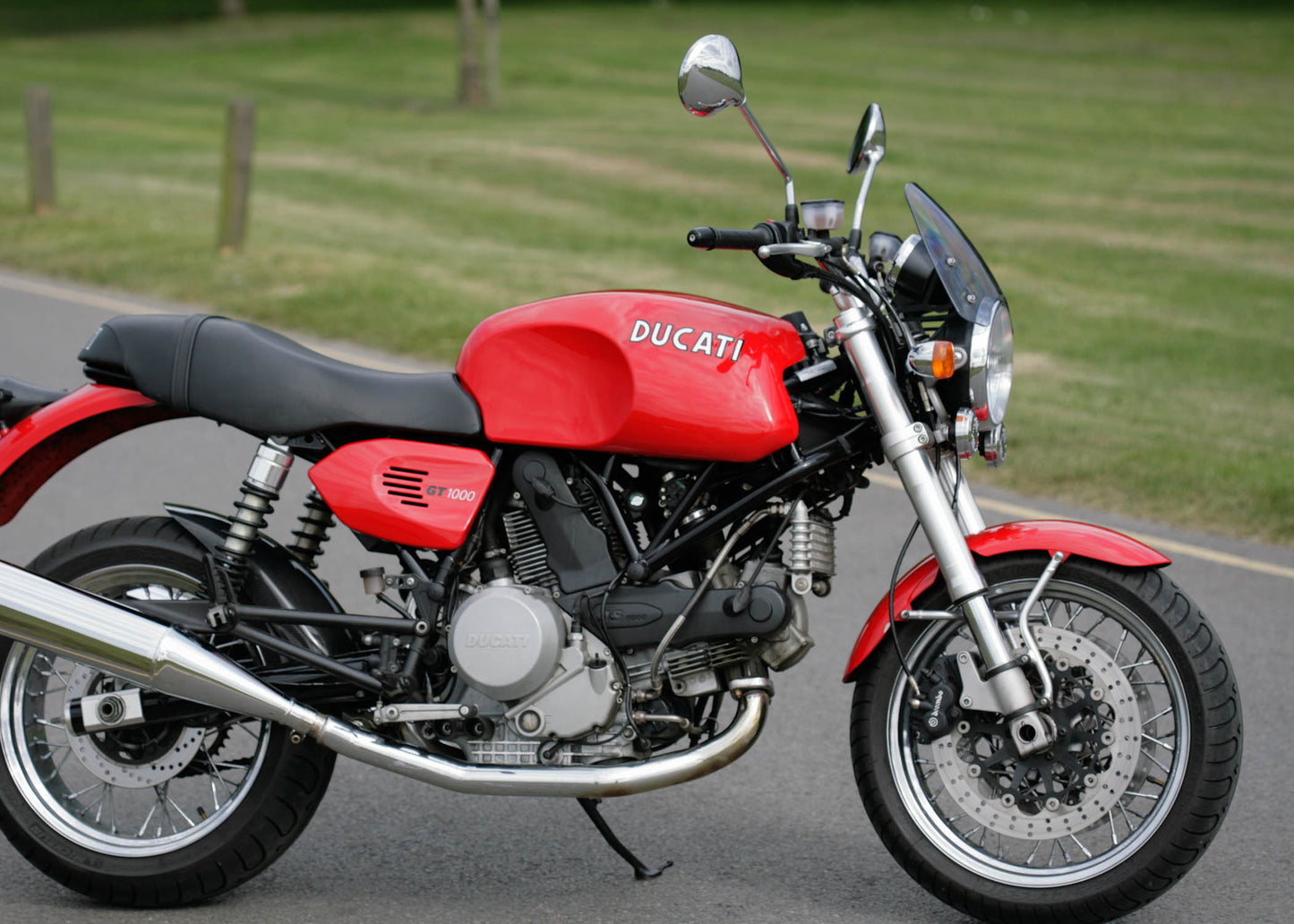 Ducati Sport Classic in red with a clear tinted Dart Flyscreen